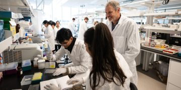 Dr. Peter Zandstra pictured in a lab with researchers
