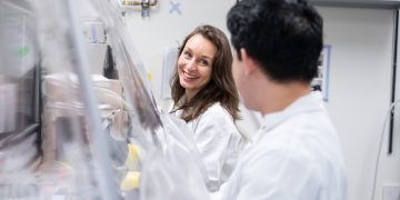 Dr. Carolina Tropini, left, and biomedical researcher colleague in a lab
